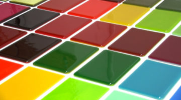 This lesson combines 21 sheet glass styles to demonstrate how many custom colors you can make by combining hues from Bullseye's palette.